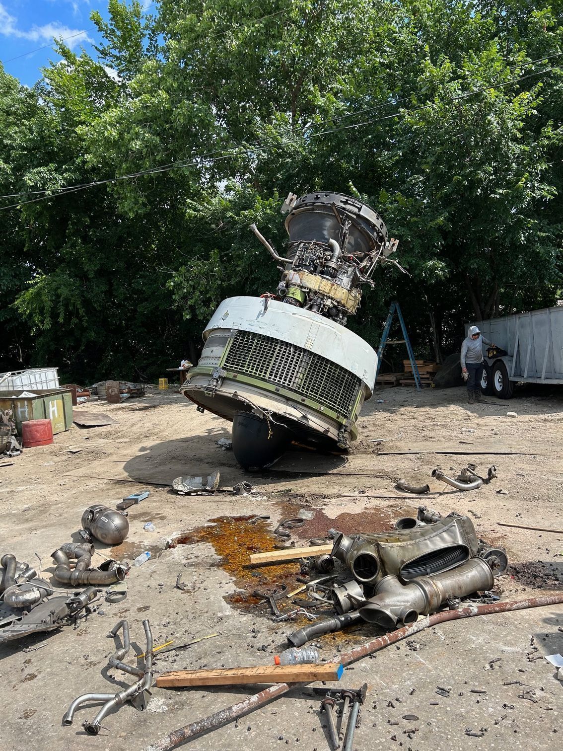 Disassembled aircraft engine and high-value components in a recovery yard